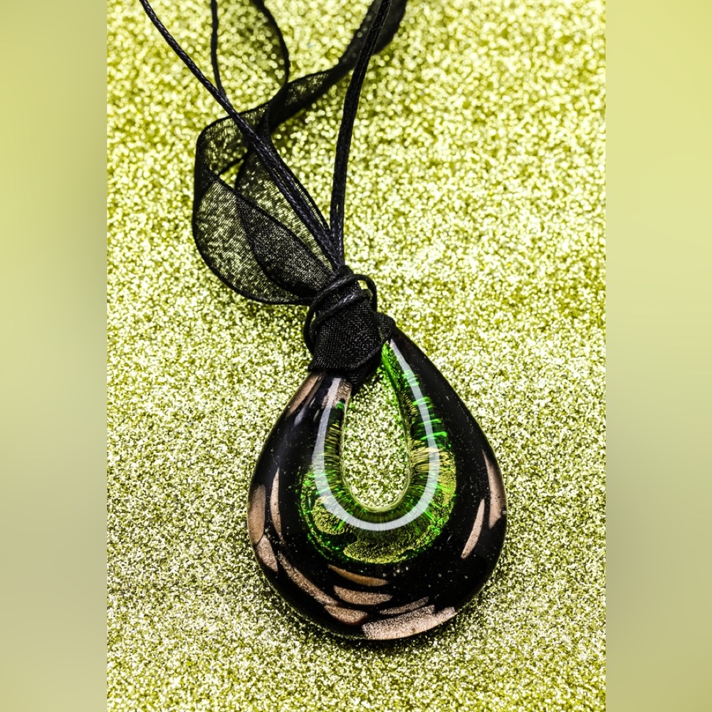 Handmade green and gold glass loop pendant.